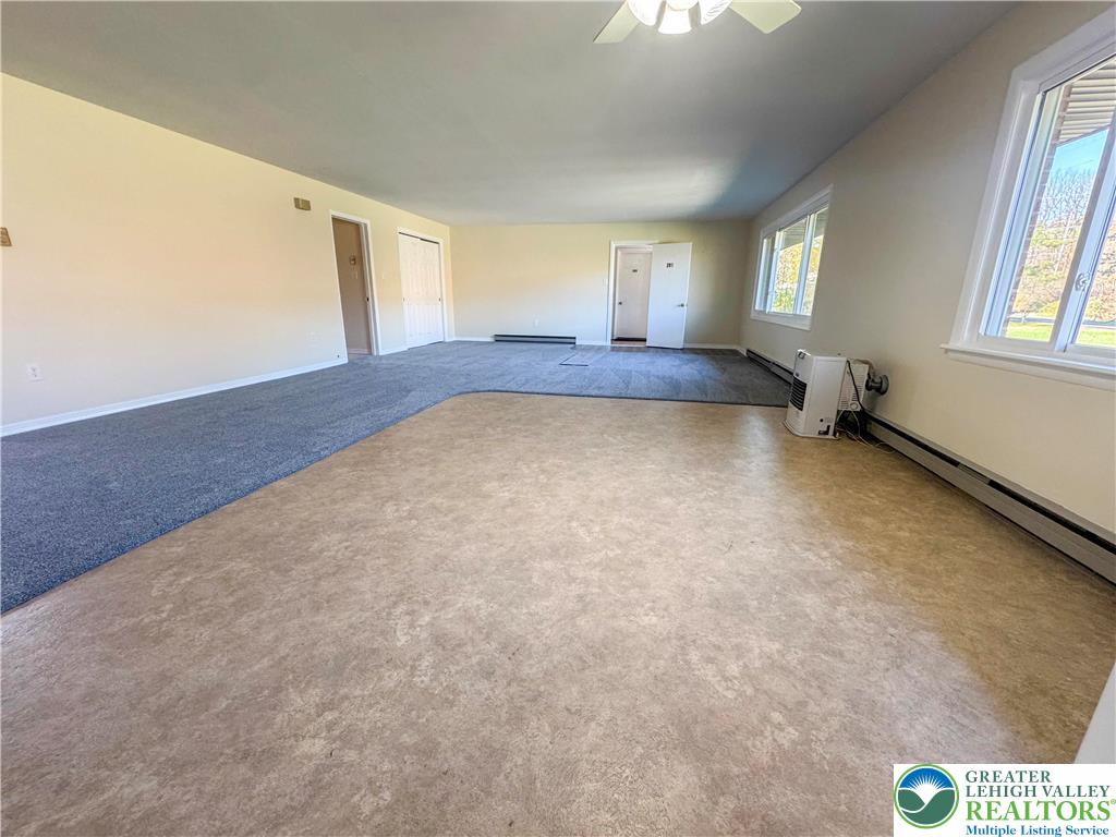 1350 Kunkletown Road, Unit 201 Saylorsburg, PA 18353 - Photo 5 of 15 a view of an empty room with windows