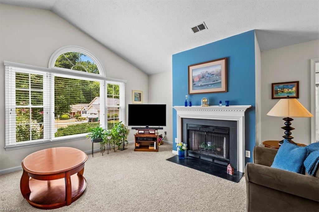 814 James Road High Point, NC 27265 - Photo 3 of 35 Living Room with vaulted ceilings and fireplace