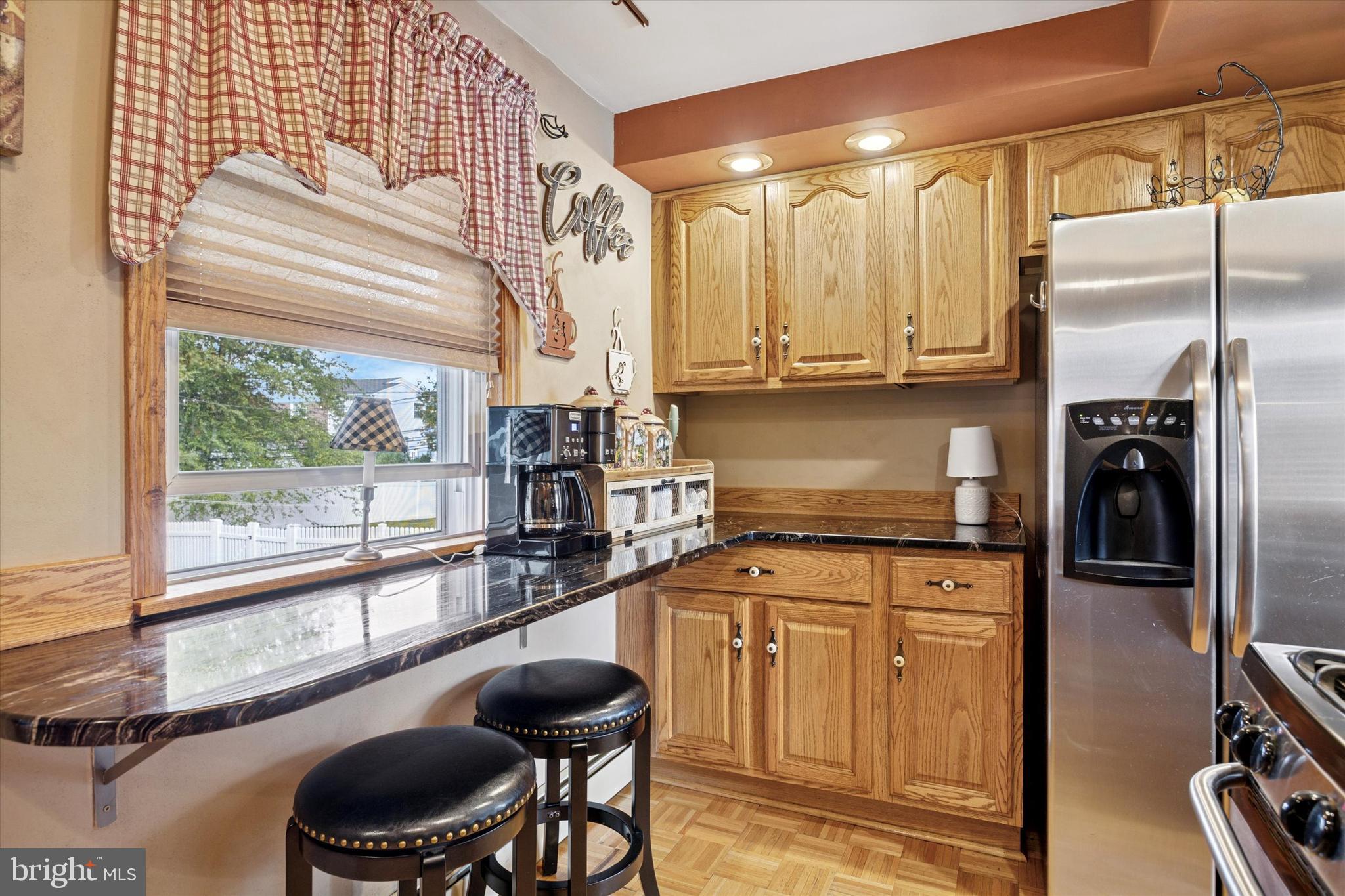 730 Dutton Circle Springfield, PA 19064 - Photo 11 of 38 a kitchen with stainless steel appliances granite countertop a stove and a refrigerator