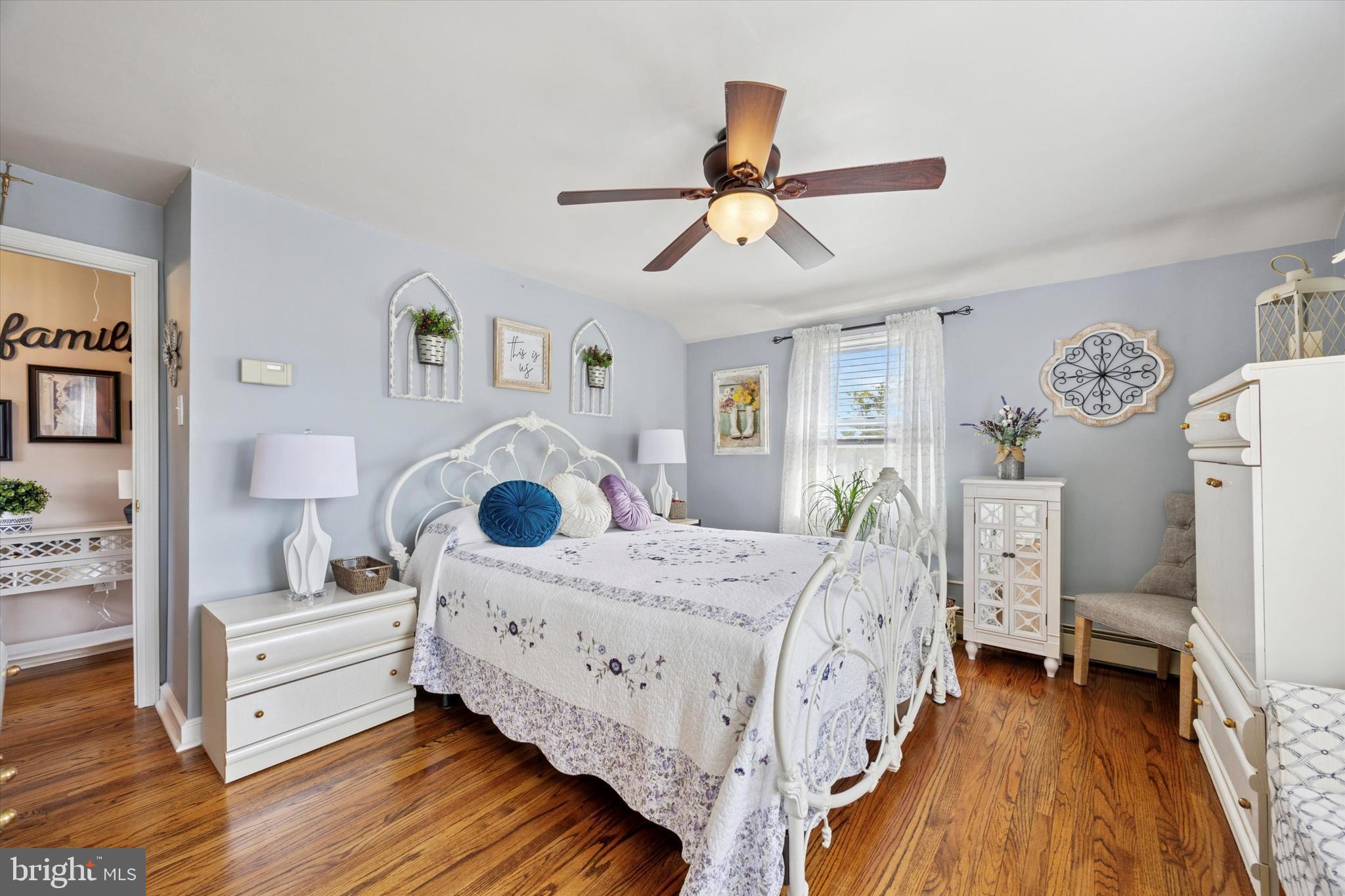 730 Dutton Circle Springfield, PA 19064 - Photo 19 of 38 a bedroom with a bed and a chandelier