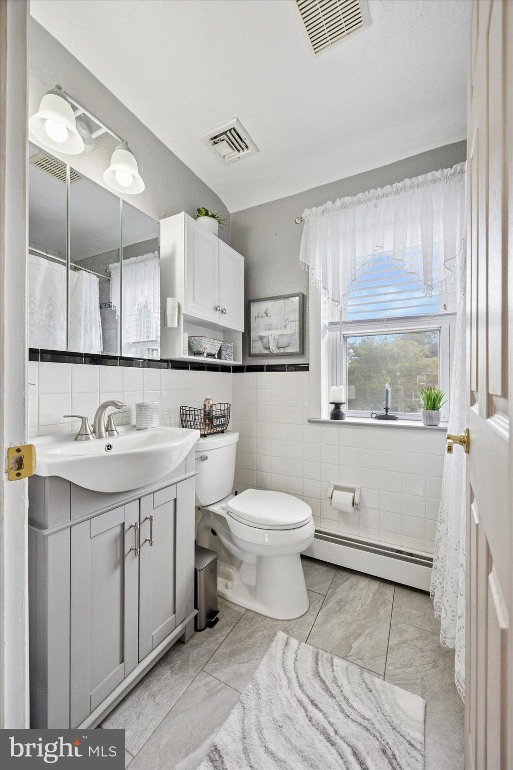 730 Dutton Circle Springfield, PA 19064 - Photo 22 of 38 a bathroom with a sink a toilet and vanity