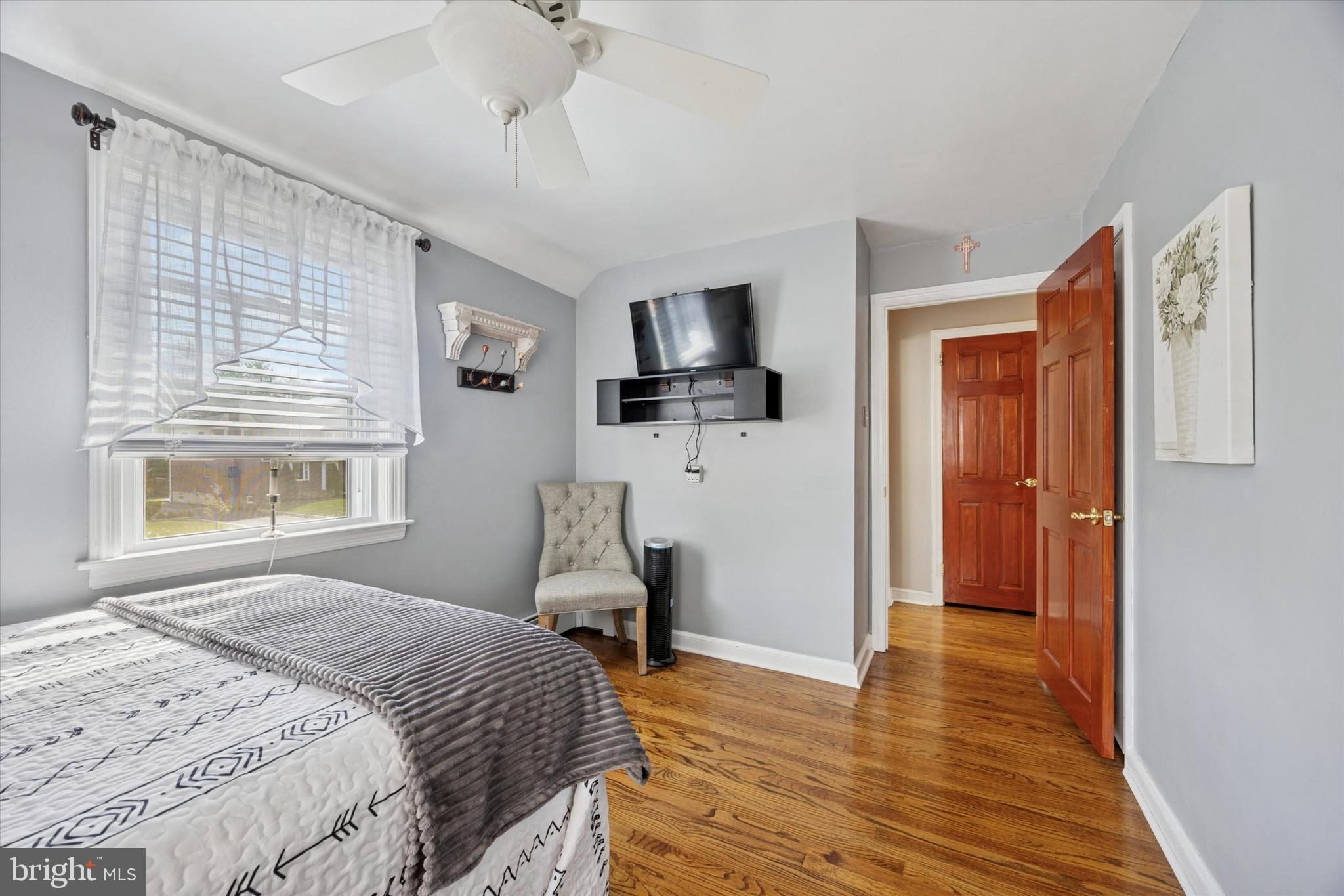 730 Dutton Circle Springfield, PA 19064 - Photo 24 of 38 a bedroom with a bed and wooden floor