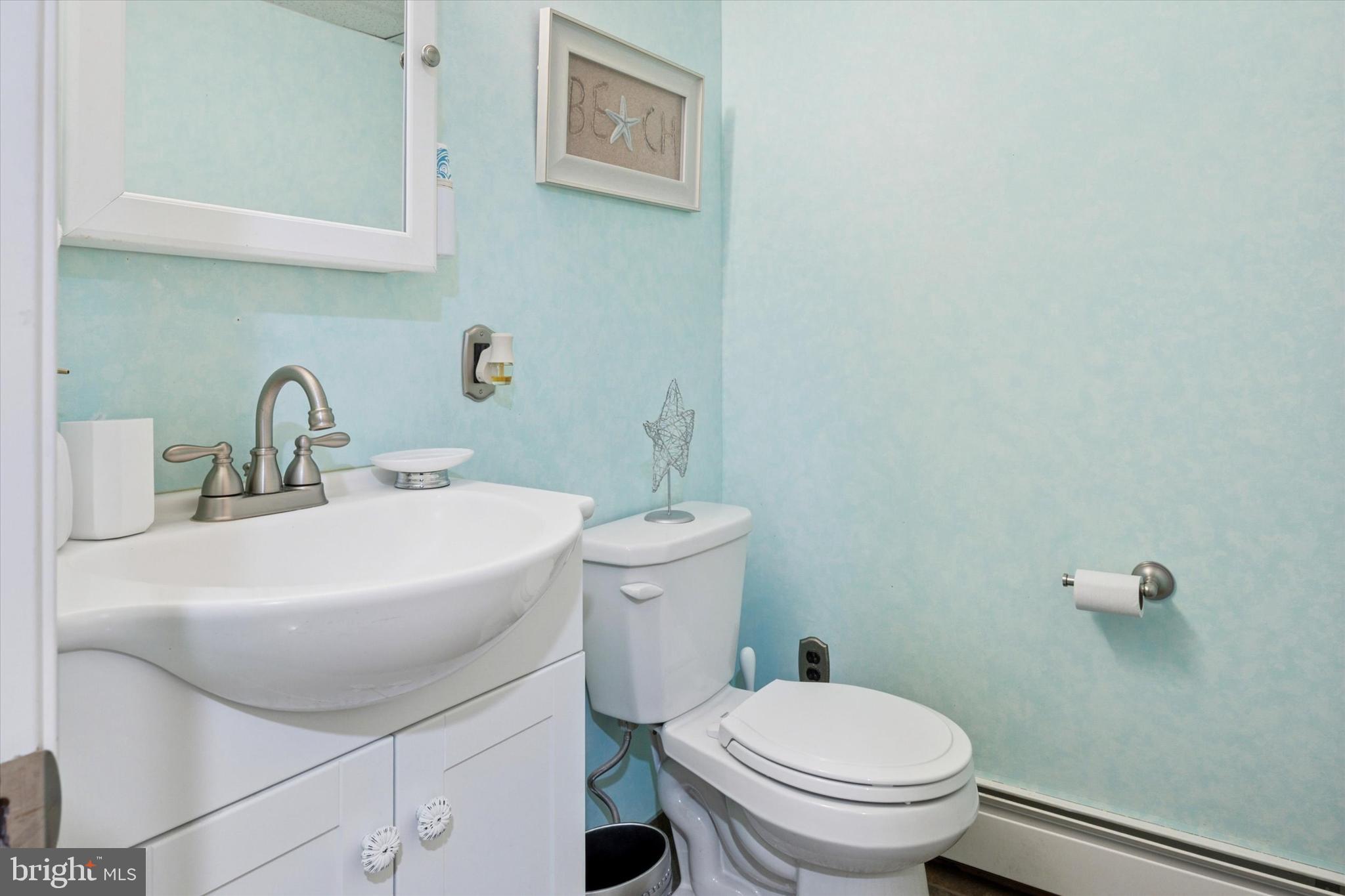 730 Dutton Circle Springfield, PA 19064 - Photo 28 of 38 a bathroom with a sink a toilet and mirror