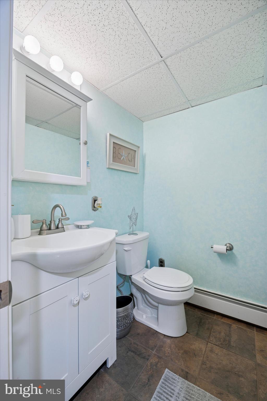 730 Dutton Circle Springfield, PA 19064 - Photo 29 of 38 a bathroom with a toilet sink and mirror