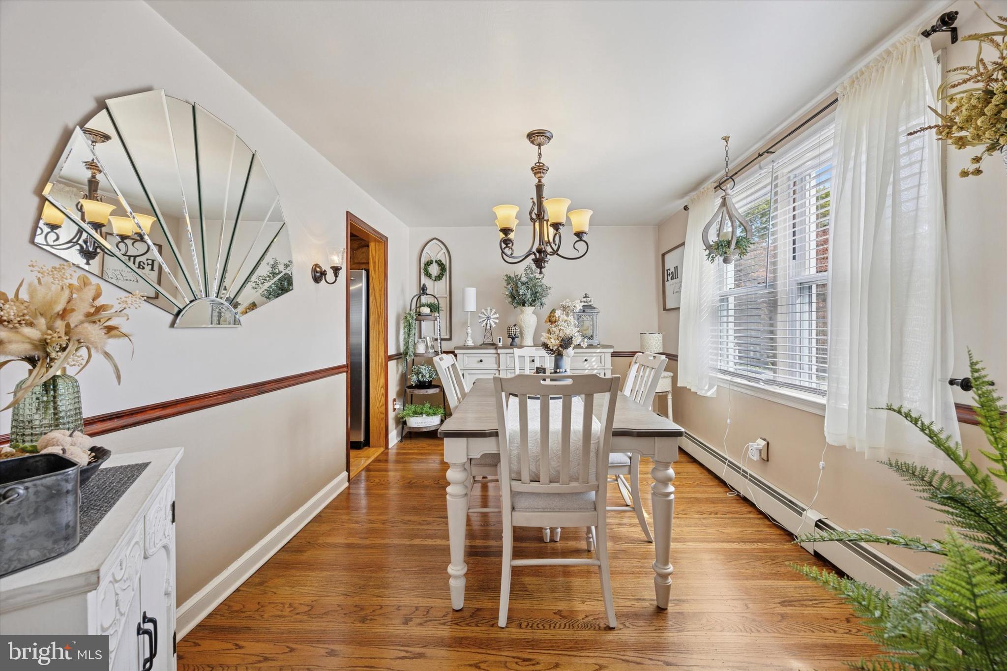 730 Dutton Circle Springfield, PA 19064 - Photo 8 of 38 a view of a dining room with furniture window and wooden floor