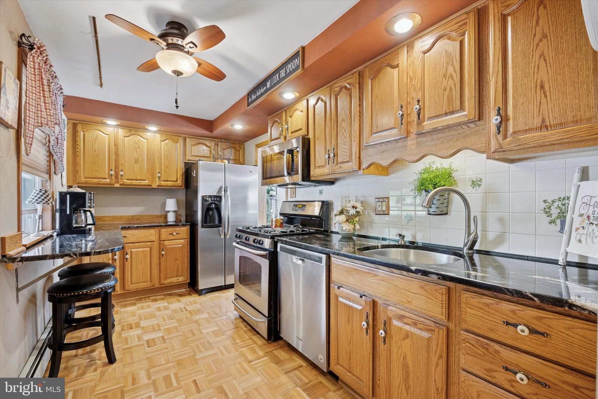 730 Dutton Circle Springfield, PA 19064 - Photo 9 of 38 a kitchen with a sink cabinets and stainless steel appliances