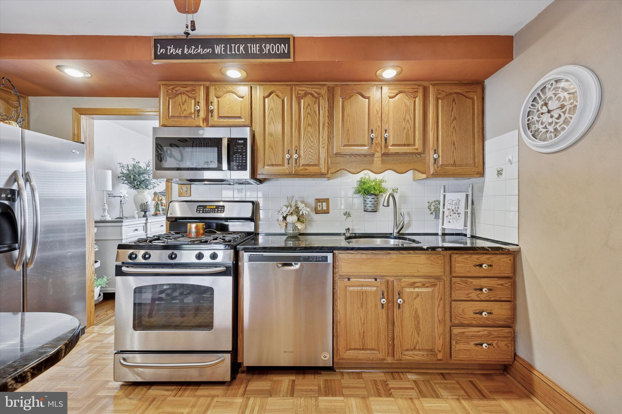 730 Dutton Circle Springfield, PA 19064 - Photo 10 of 38 a kitchen with stainless steel appliances granite countertop a stove a sink and a refrigerator
