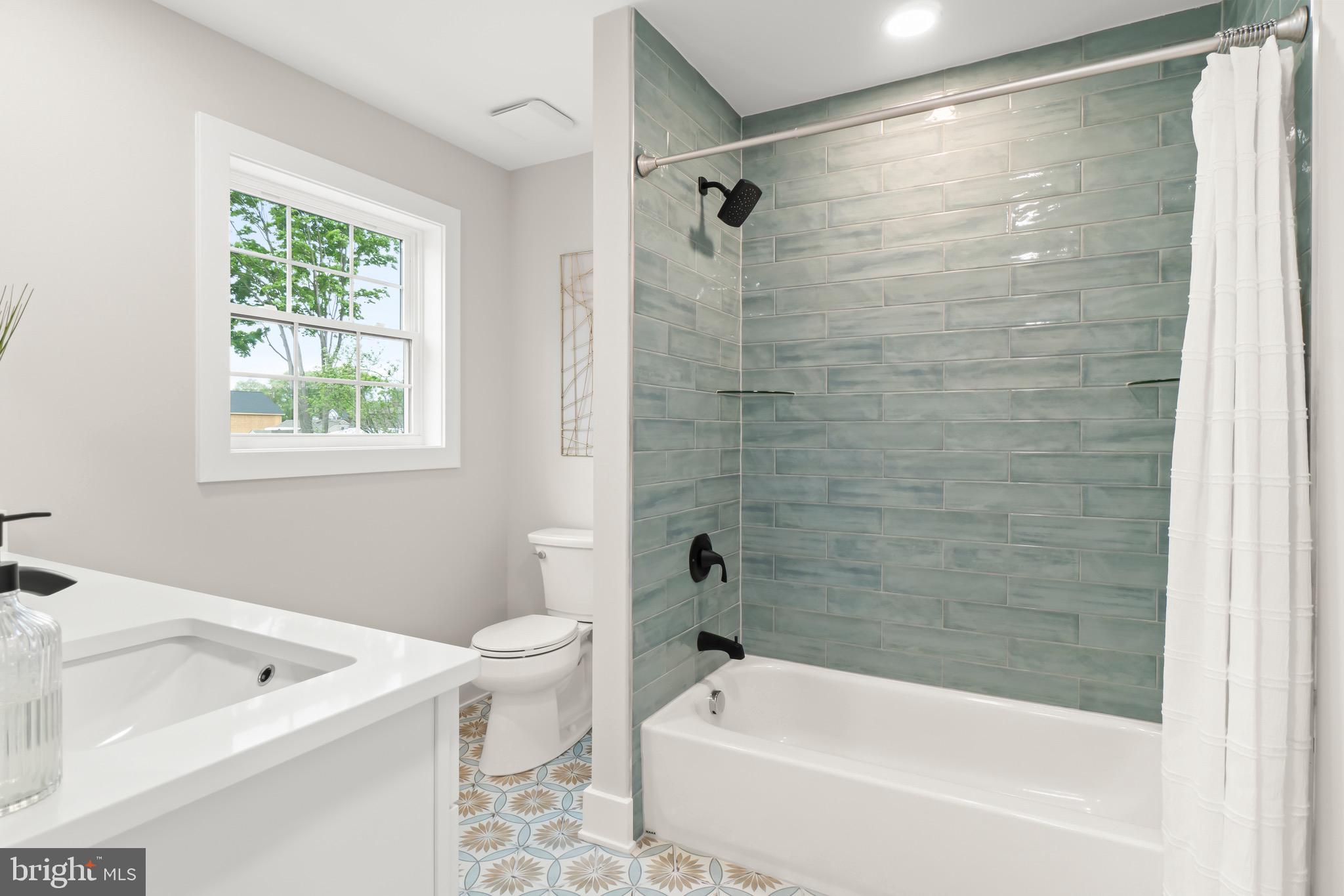 1505 Chestnut Avenue Haddon Heights, NJ 08035 - Photo 30 of 38 a bathroom with a bath tub a toilet and a sink