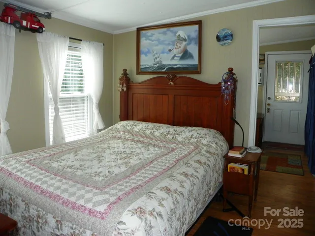 a bedroom with furniture and a window