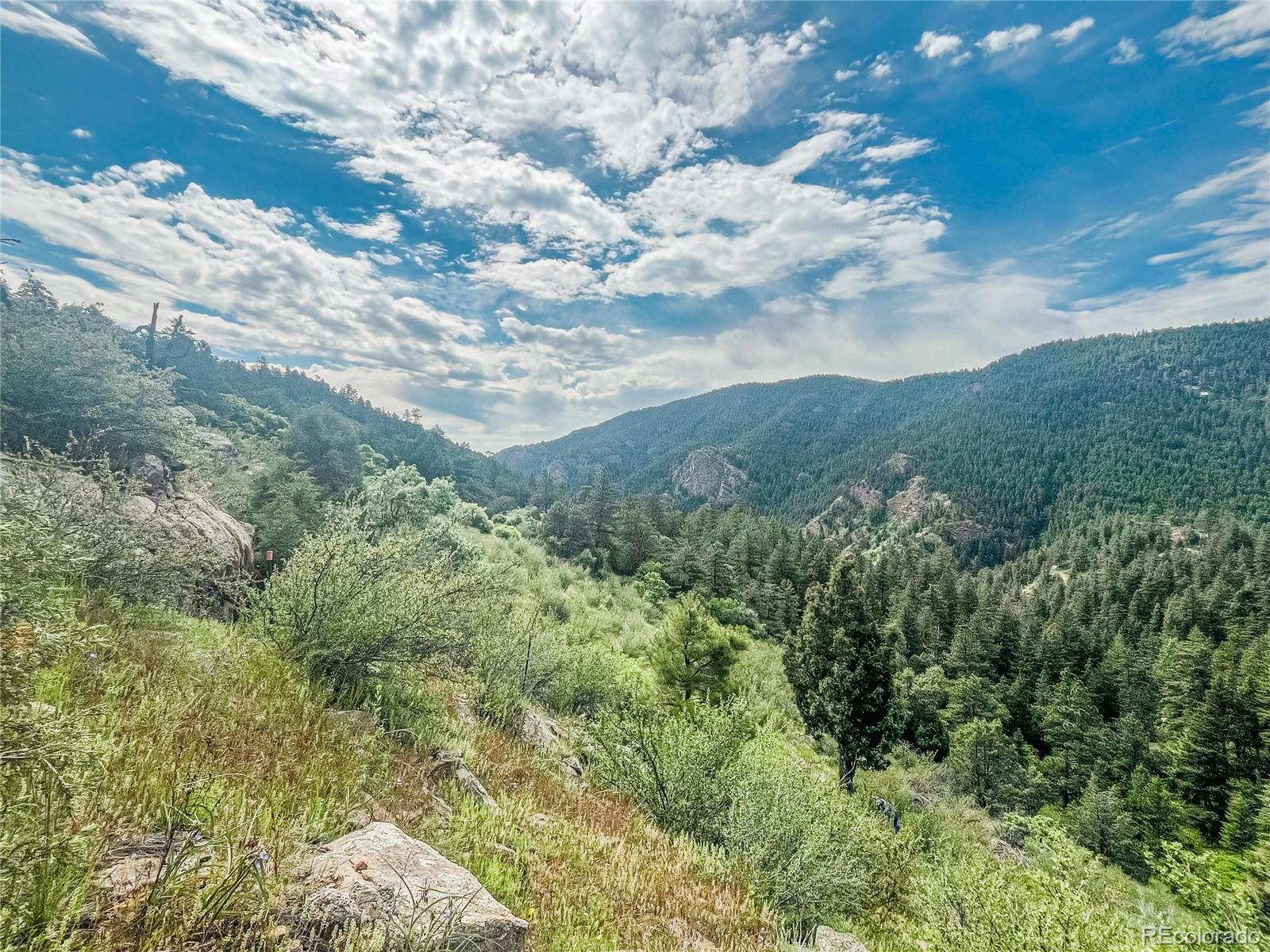 0 Raven Gulch Road Indian Hills, CO 80454 - Photo 6 of 21 a view of a field of mountains and valleys