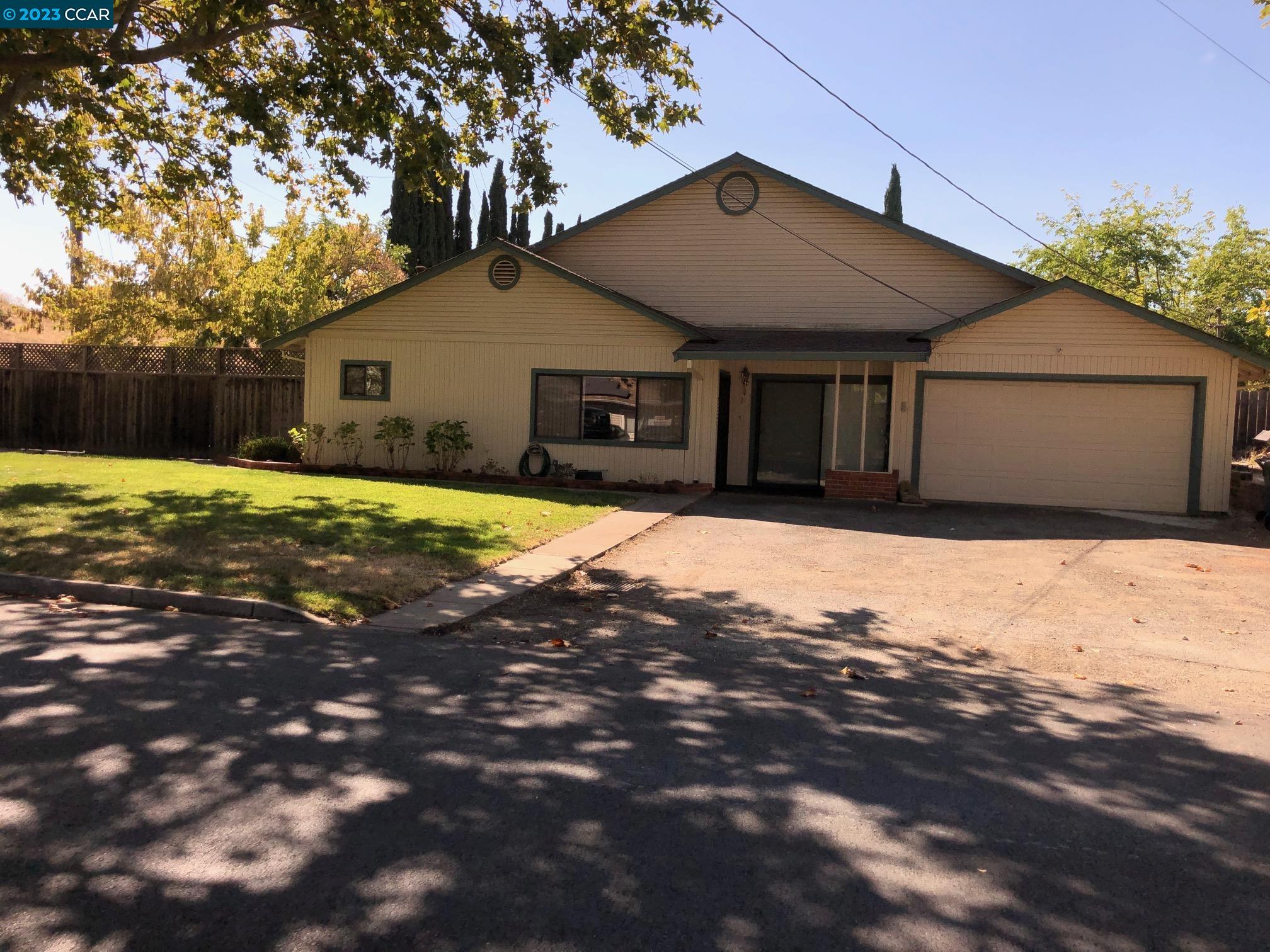 a house with trees in the background