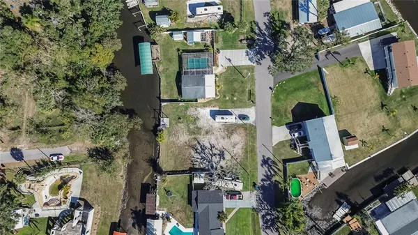 an aerial view of a house with a yard