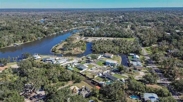 an aerial view of a house with a yard