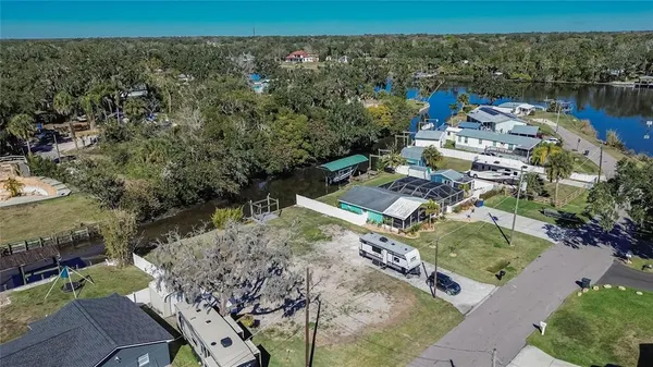an aerial view of a house with a lake view