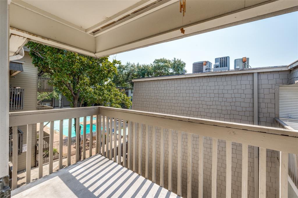 4859 Cedar Springs Road, Unit 337 Dallas, TX 75219 - Photo 11 of 20 a view of a balcony with wooden floor