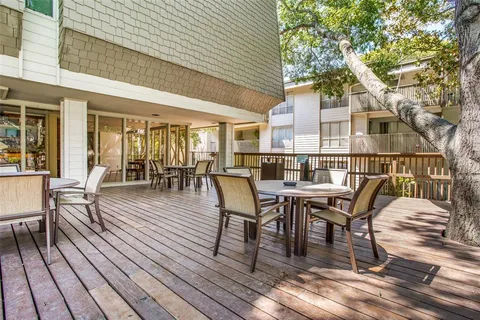 a dining space with furniture and wooden floor