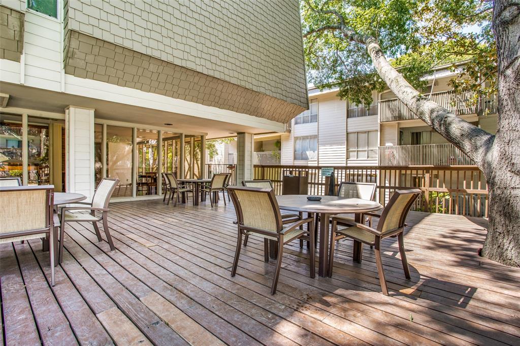 4859 Cedar Springs Road, Unit 337 Dallas, TX 75219 - Photo 13 of 20 a dining space with furniture and wooden floor