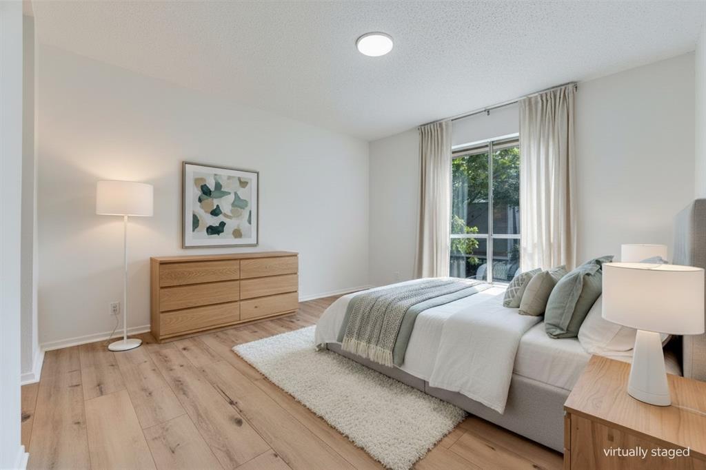 4859 Cedar Springs Road, Unit 337 Dallas, TX 75219 - Photo 5 of 27 a bedroom with a bed and a window