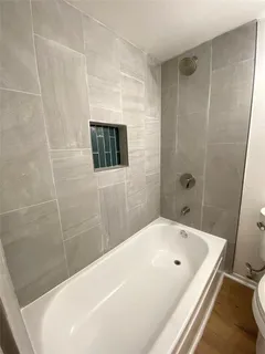 a bathroom with a white tub