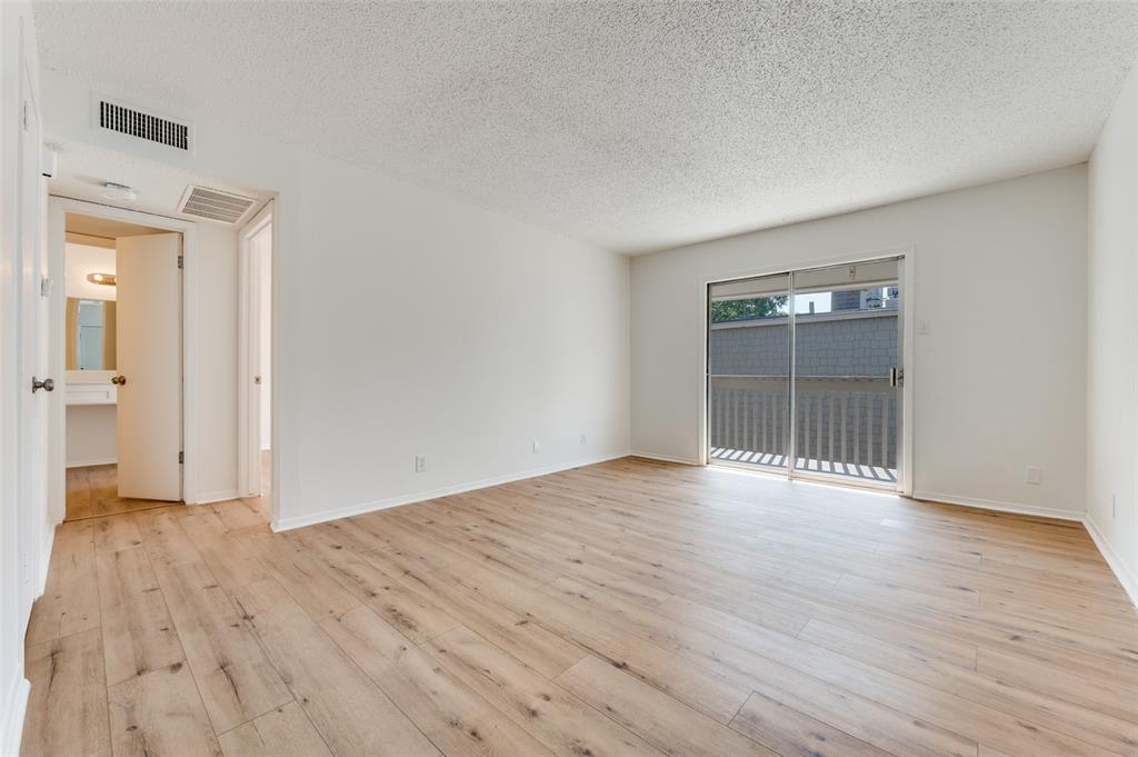 4859 Cedar Springs Road, Unit 337 Dallas, TX 75219 - Photo 7 of 20 wooden floor in an empty room
