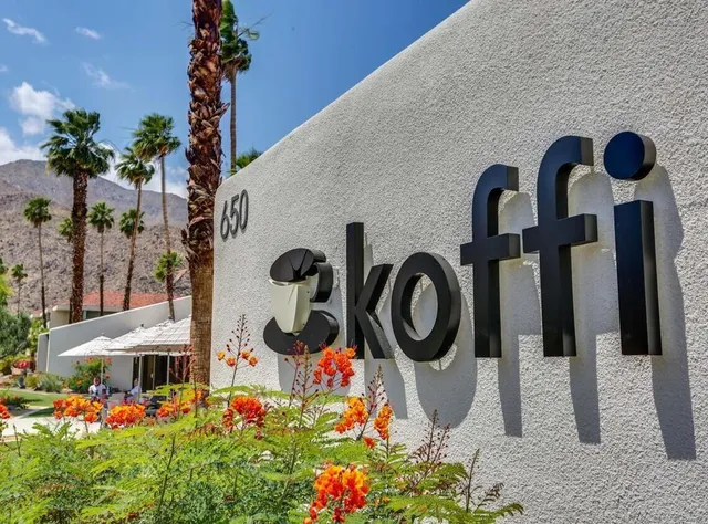 a view of a balcony with a table and chairs