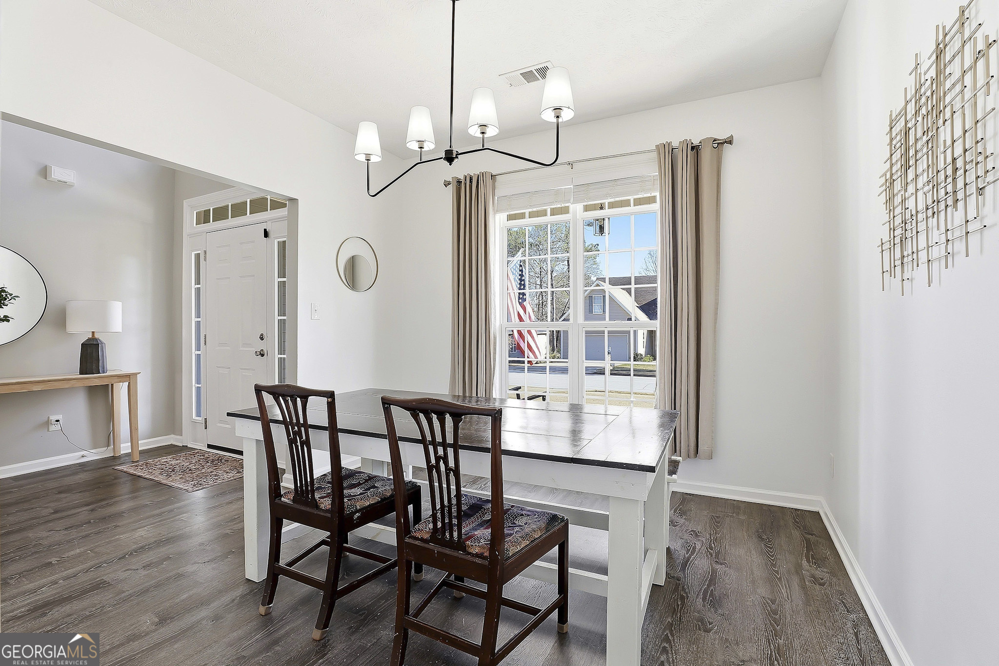 320 Emerald Way Senoia, GA 30276 - Photo 12 of 57 a view of a dining room with furniture window and wooden floor