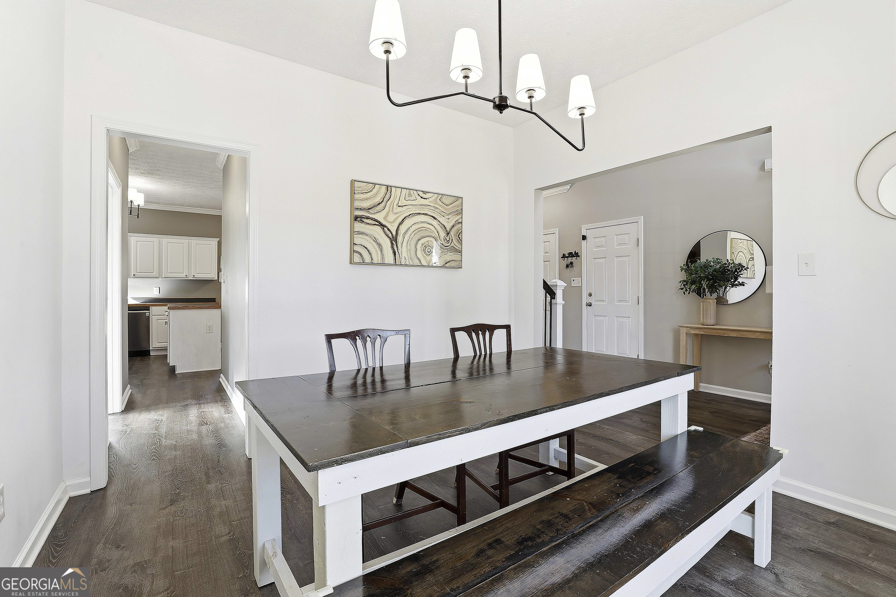 320 Emerald Way Senoia, GA 30276 - Photo 13 of 57 a kitchen with a table chairs and cabinets
