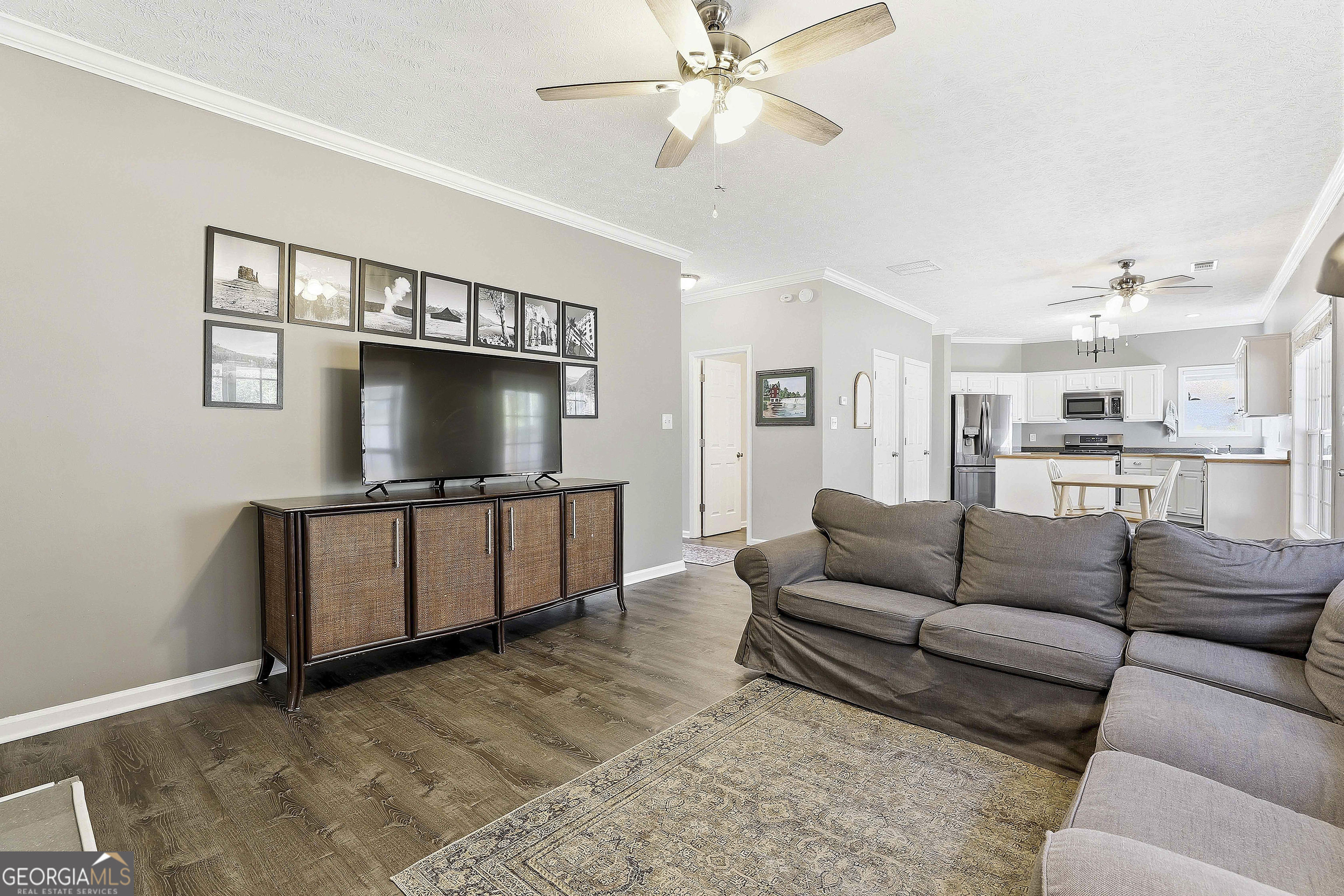 320 Emerald Way Senoia, GA 30276 - Photo 18 of 57 a living room with furniture and a flat screen tv