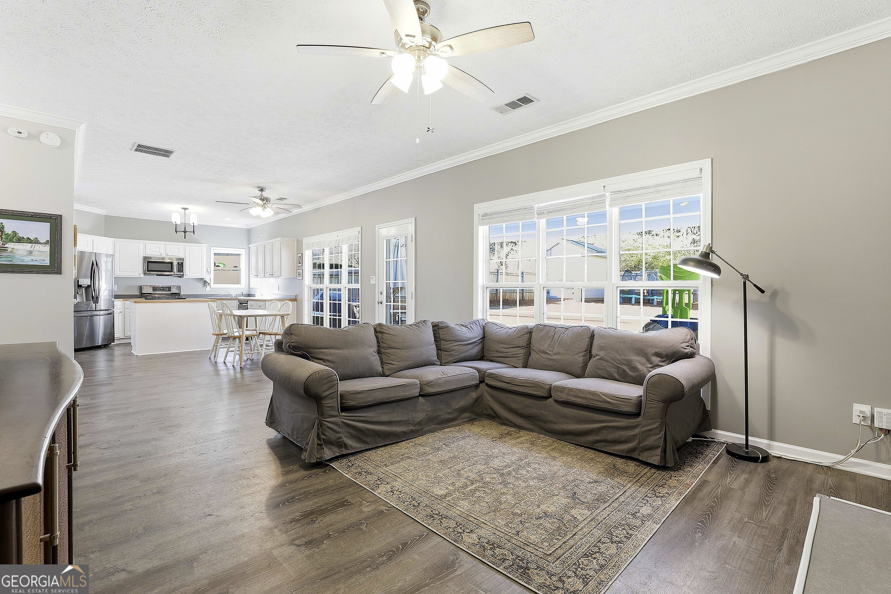 320 Emerald Way Senoia, GA 30276 - Photo 19 of 57 a living room with furniture and a large window