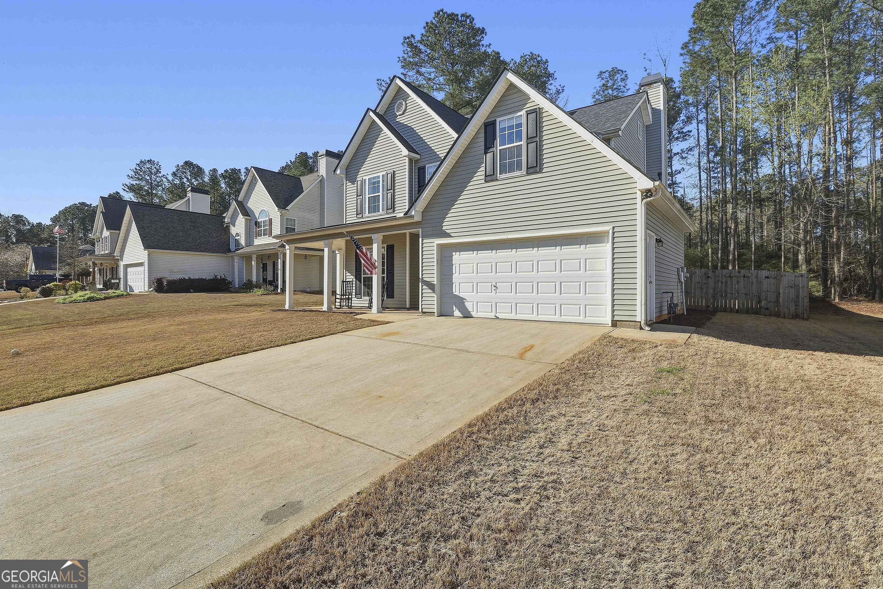 320 Emerald Way Senoia, GA 30276 - Photo 2 of 57 a front view of a house with a yard and garage