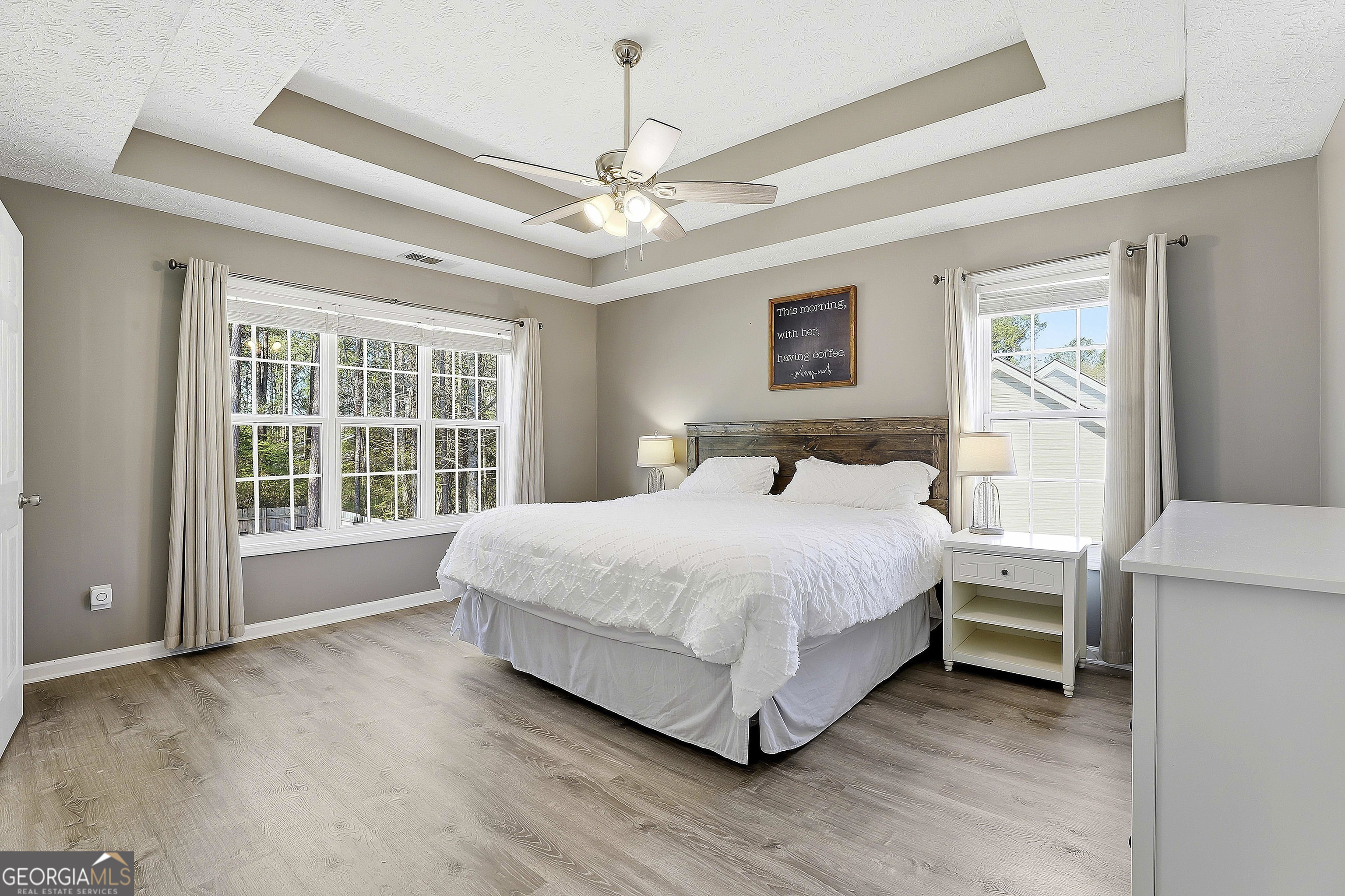 320 Emerald Way Senoia, GA 30276 - Photo 29 of 57 a spacious bedroom with a large bed and a large window