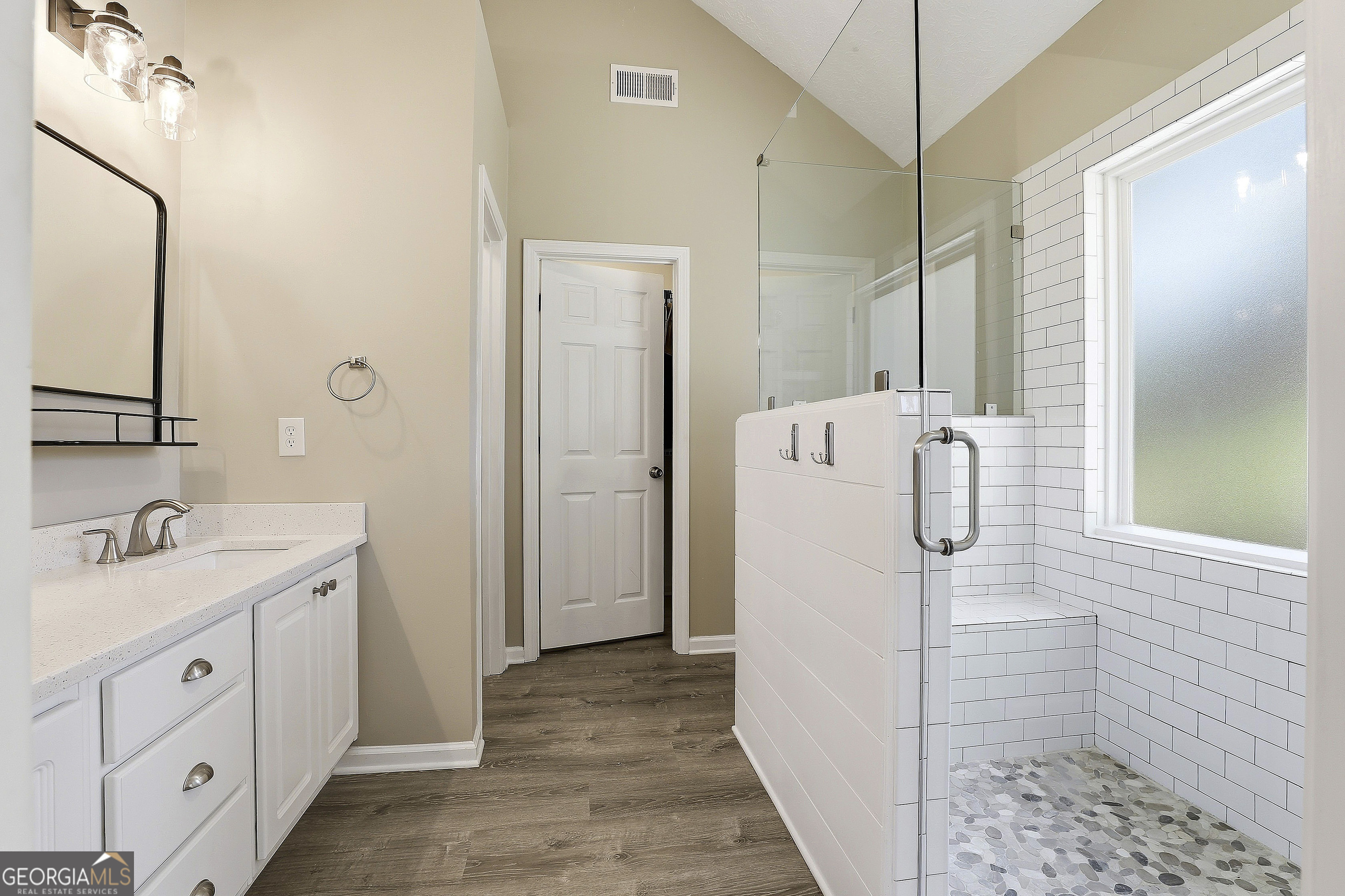 320 Emerald Way Senoia, GA 30276 - Photo 31 of 57 a bathroom with a double vanity sink and a mirror