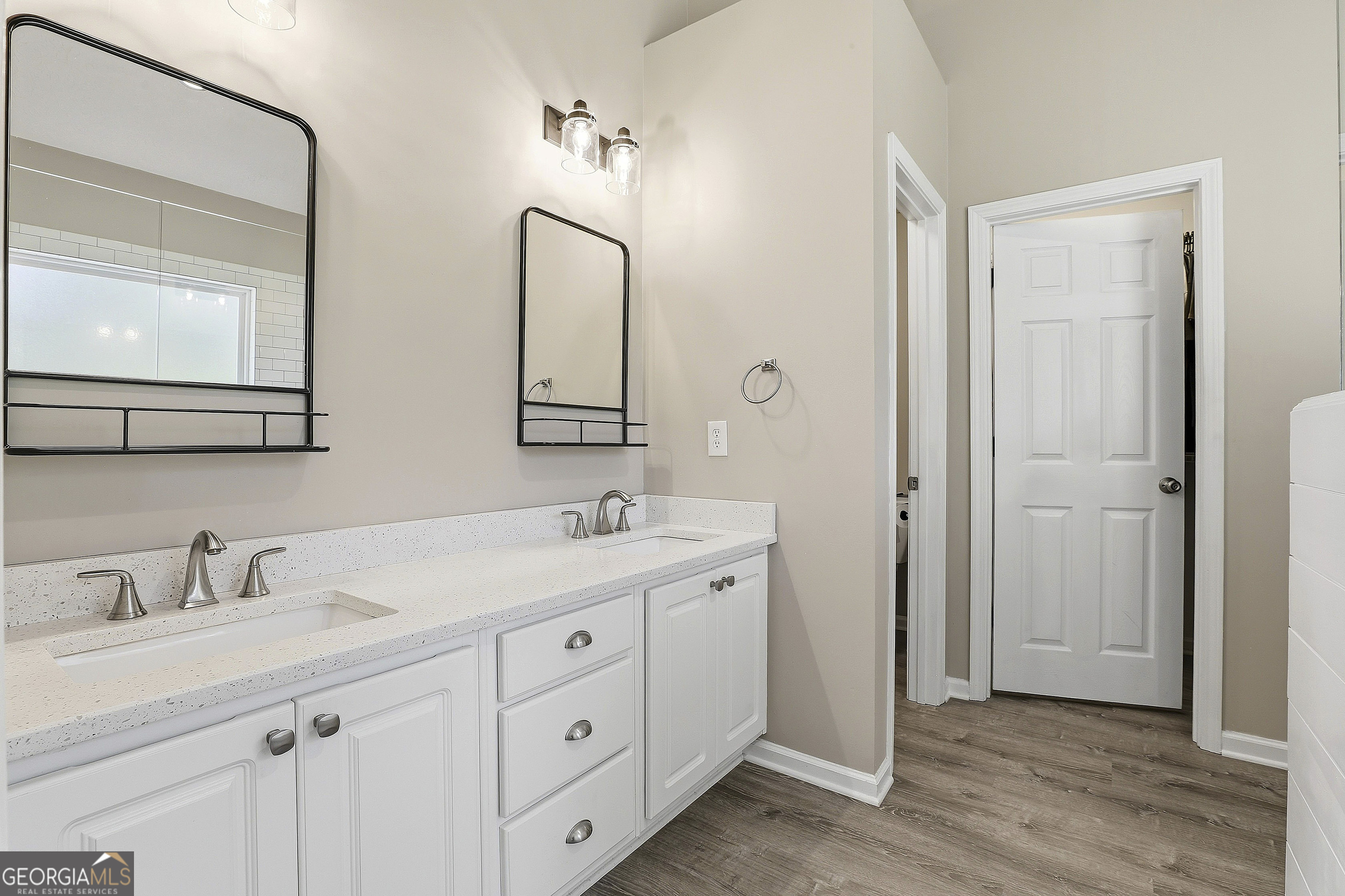 320 Emerald Way Senoia, GA 30276 - Photo 32 of 57 a bathroom with a double vanity sink mirror and