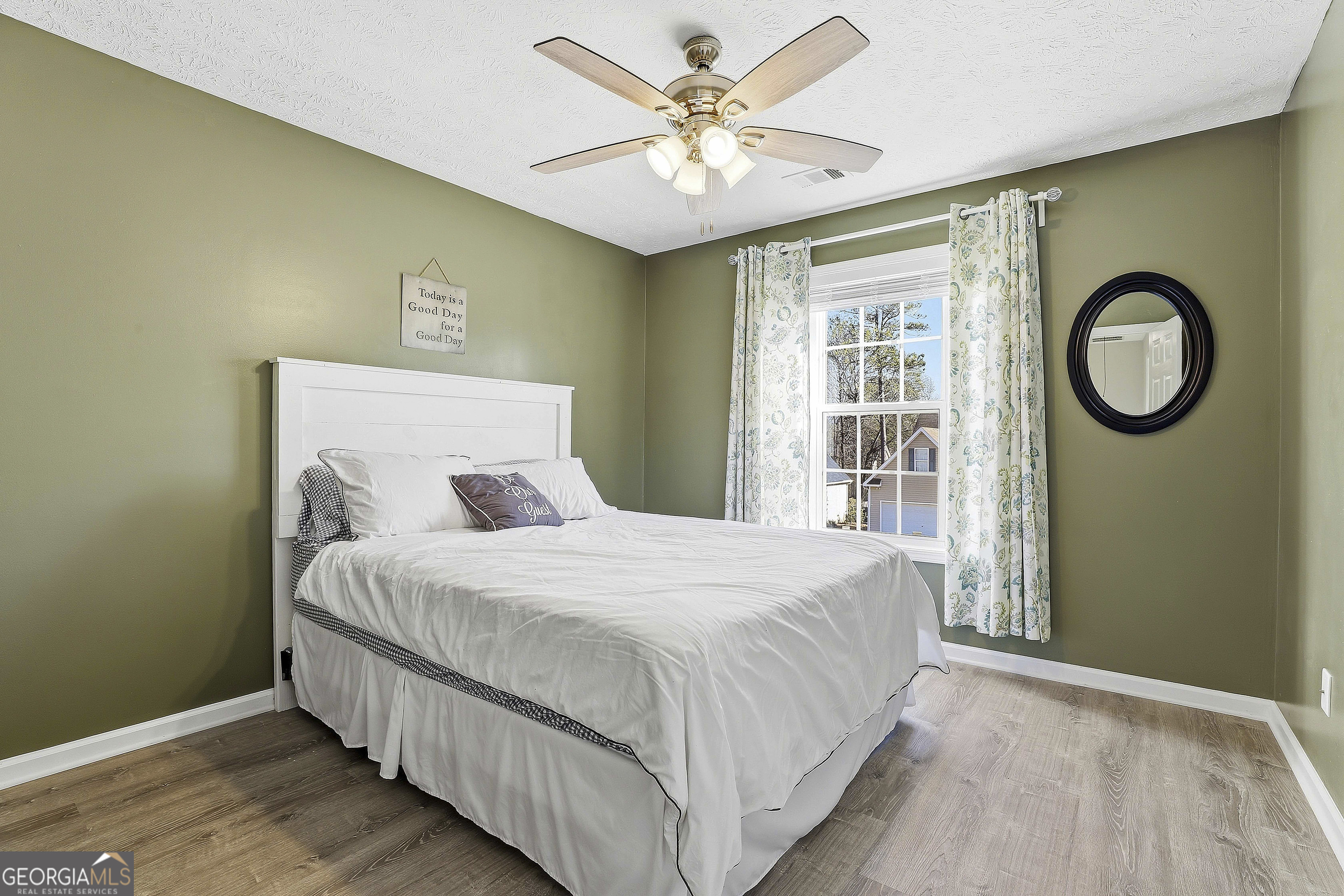 320 Emerald Way Senoia, GA 30276 - Photo 37 of 57 a bedroom with a bed mirror and a window