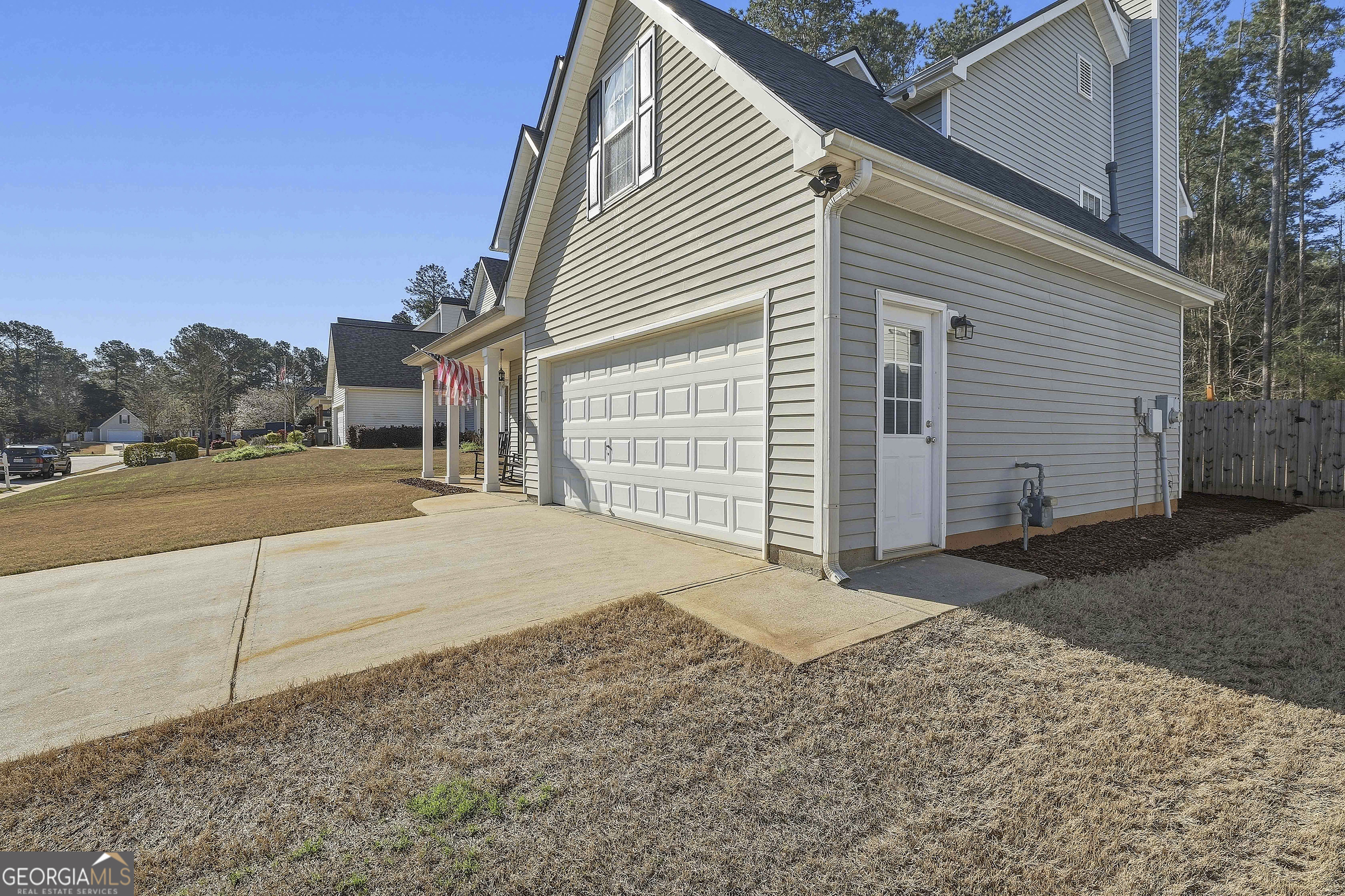 320 Emerald Way Senoia, GA 30276 - Photo 4 of 57 a view of backyard of house and car parked