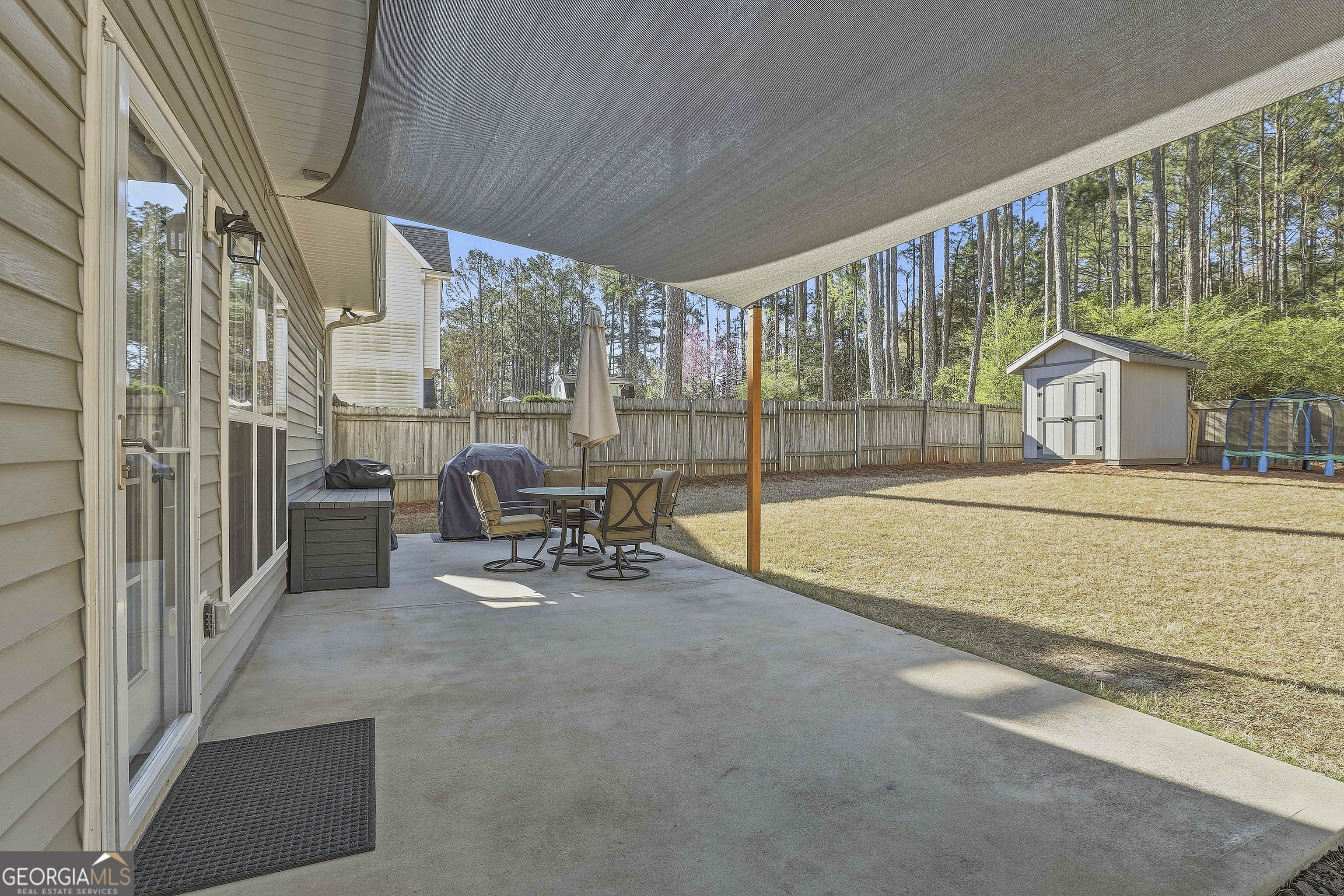 320 Emerald Way Senoia, GA 30276 - Photo 41 of 57 a view of living room with furniture and floor to ceiling window