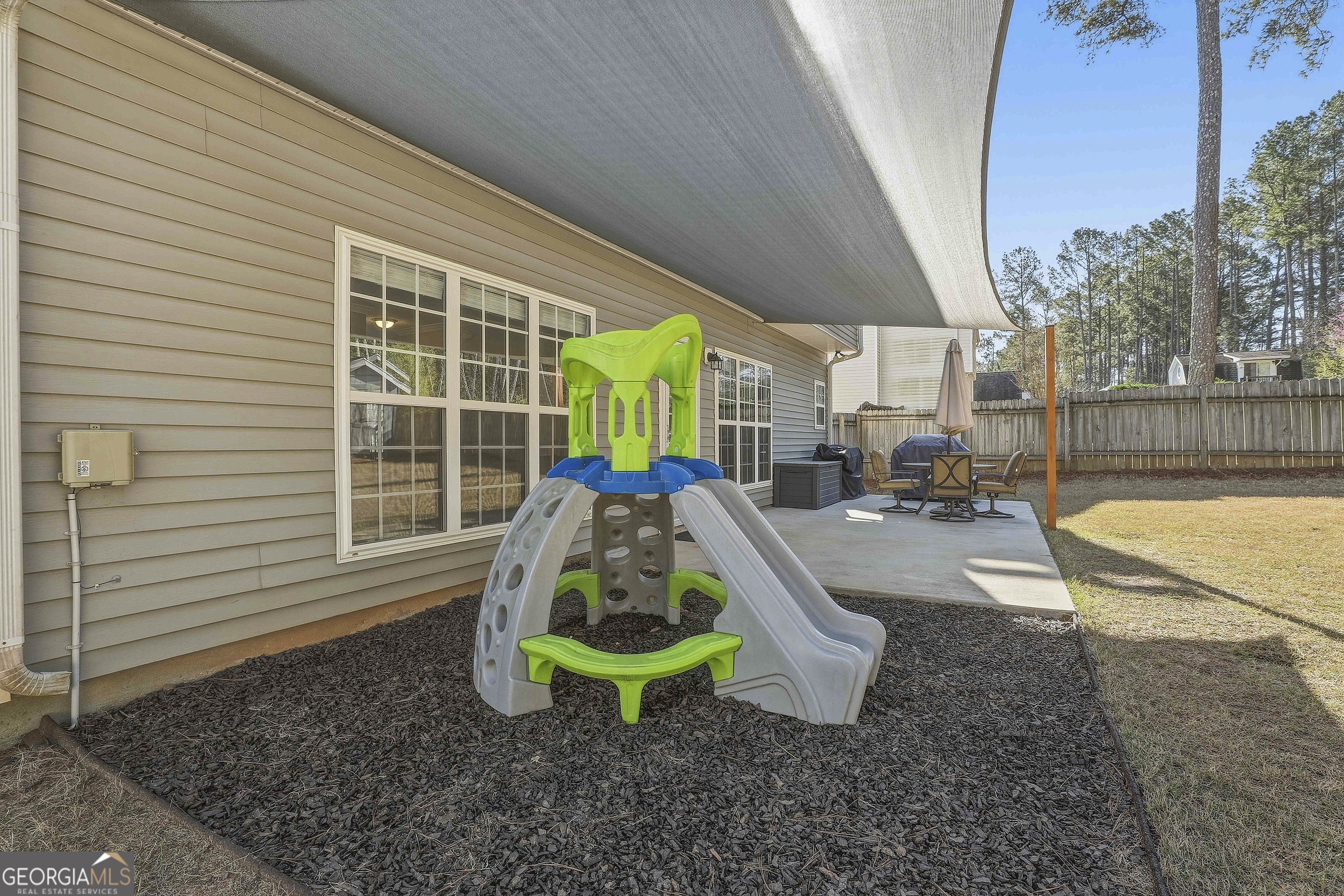 320 Emerald Way Senoia, GA 30276 - Photo 42 of 57 a view of a backyard with furniture and garden