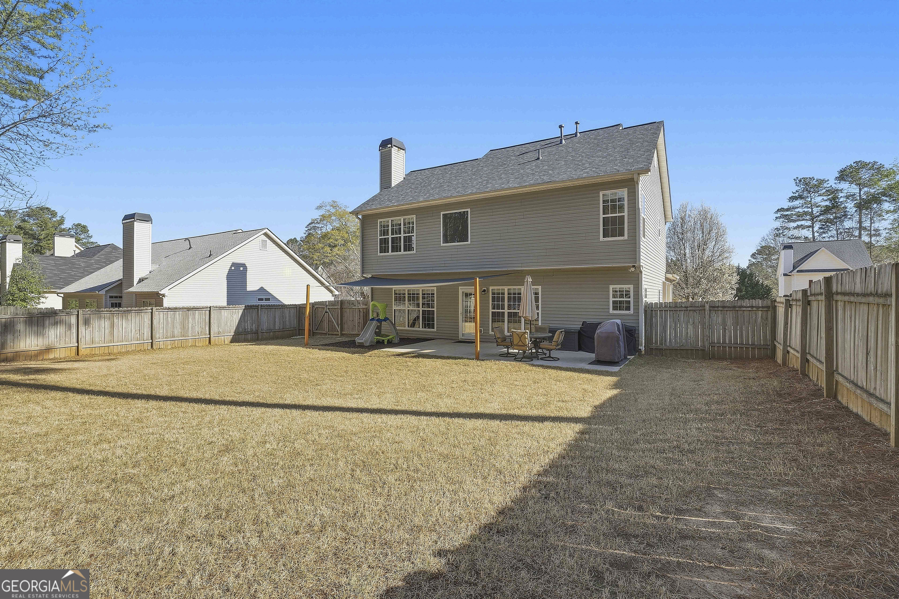 320 Emerald Way Senoia, GA 30276 - Photo 49 of 57 a front view of a house with a yard and garage