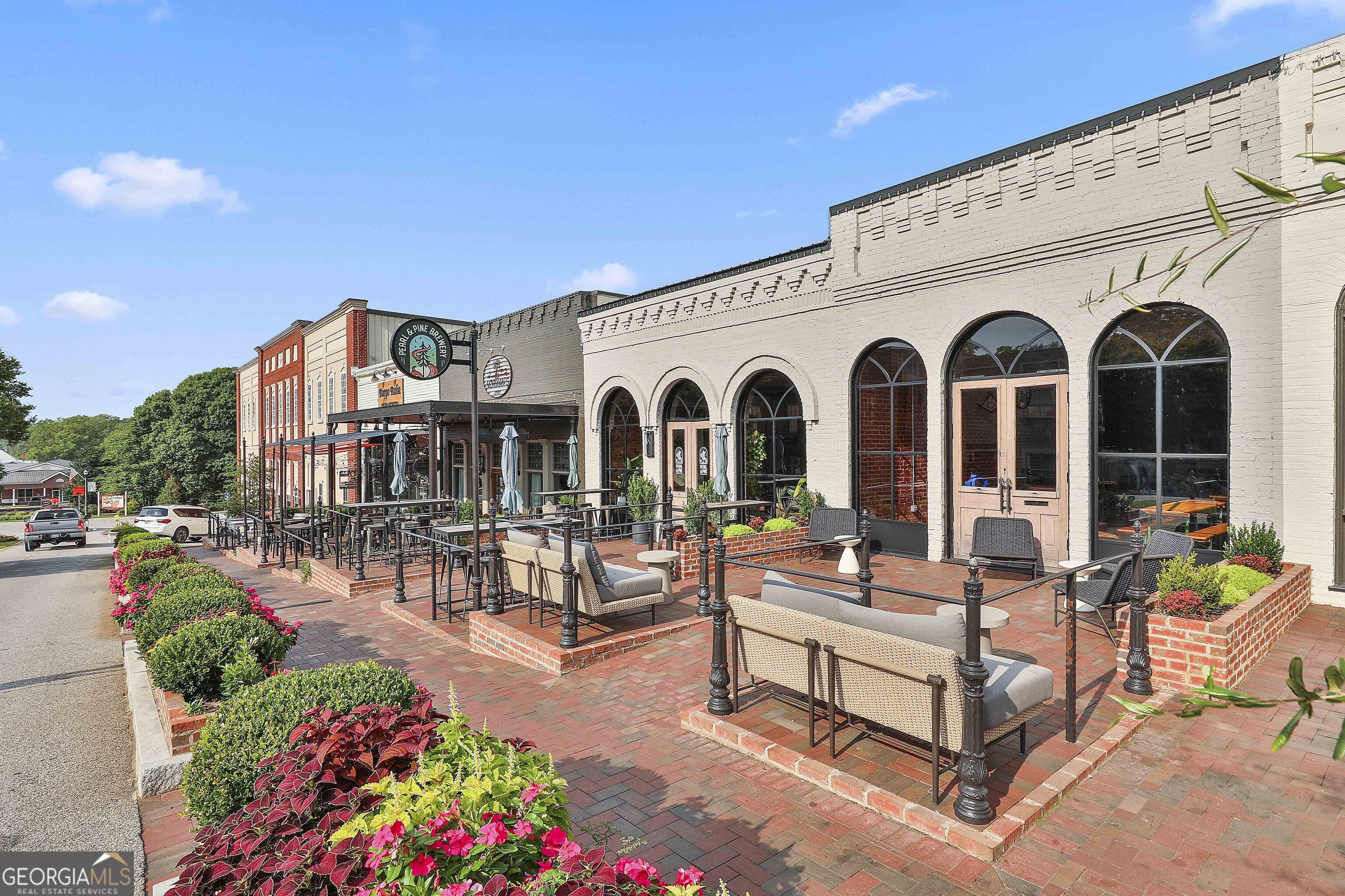 320 Emerald Way Senoia, GA 30276 - Photo 54 of 57 a view of a house with backyard sitting area and garden