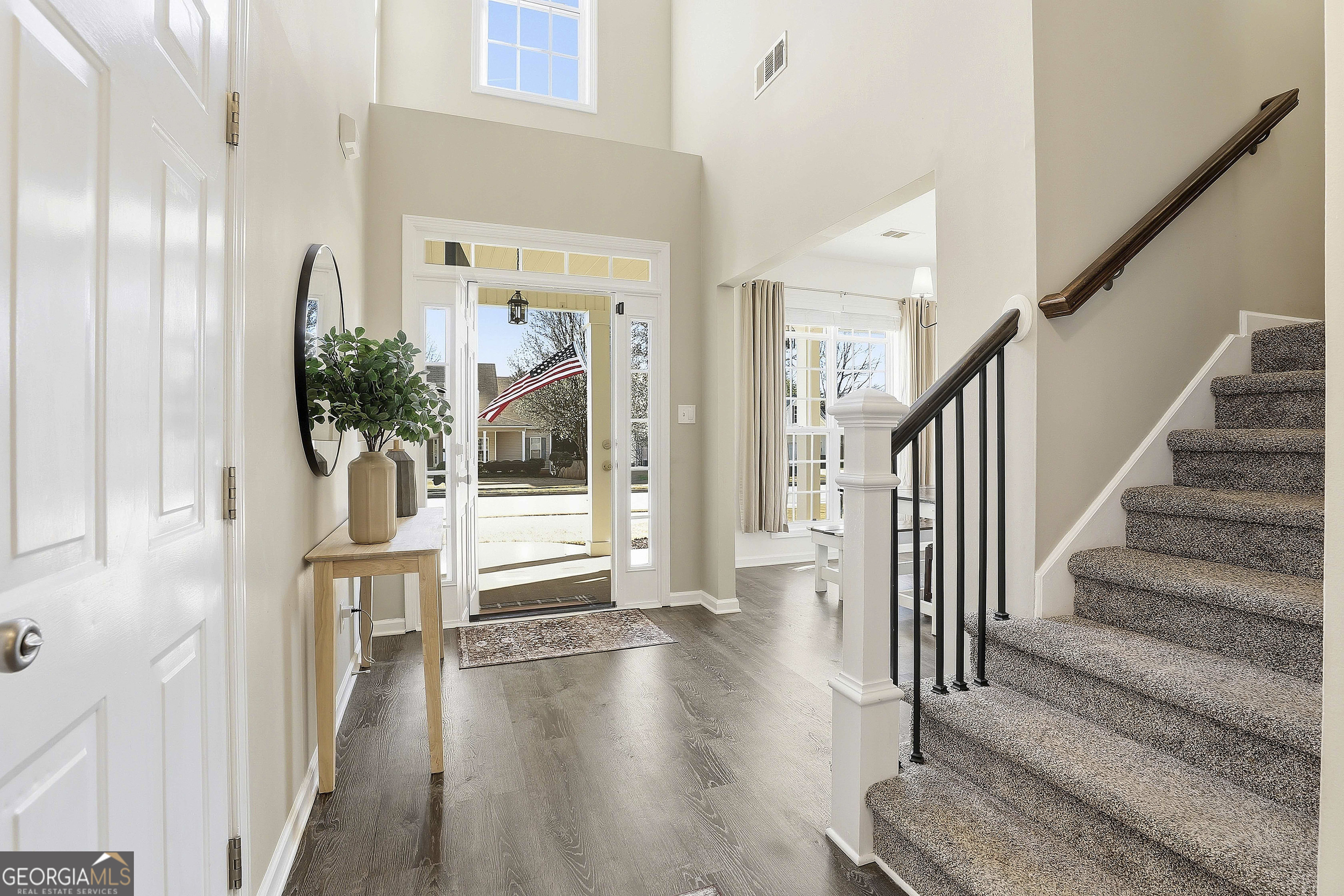 320 Emerald Way Senoia, GA 30276 - Photo 9 of 57 a view of a hallway with wooden floor and entryway