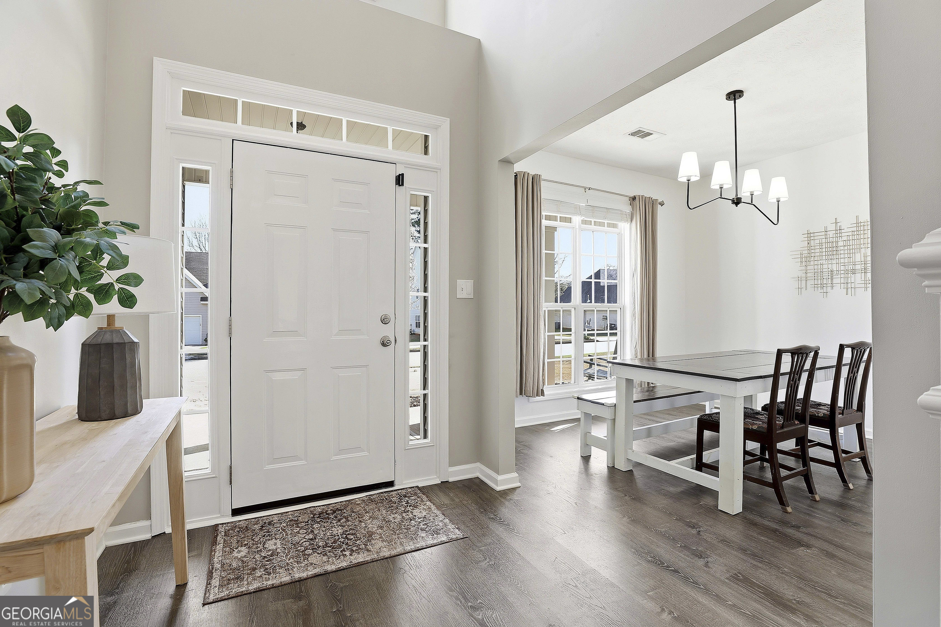 320 Emerald Way Senoia, GA 30276 - Photo 10 of 57 a view of a dining room with furniture and wooden floor