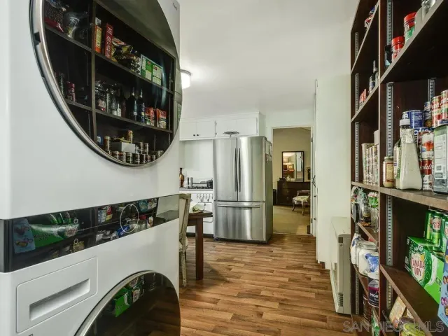 a view of washer and dryer with wooden floor