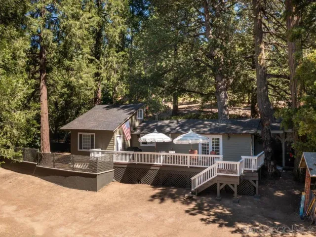 a swimming pool with outdoor seating and yard