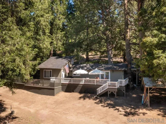 a view of a house with a yard covered with snow in the yard