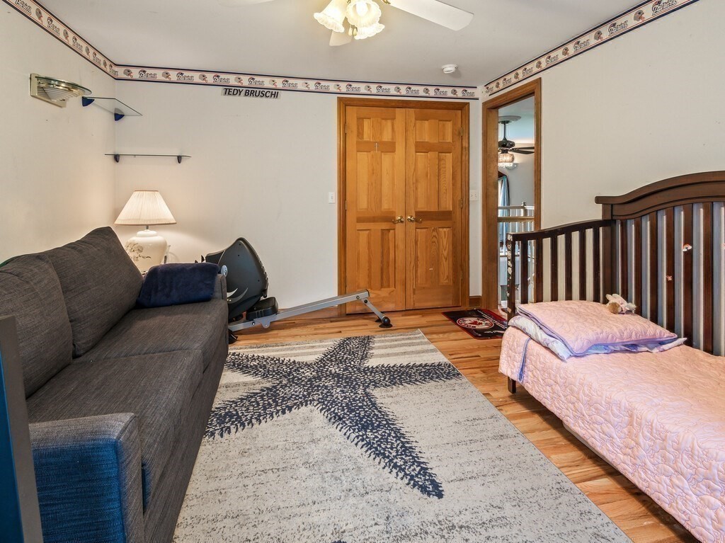 9 Santom Street Auburn, MA 01501 - Photo 22 of 42 a bedroom with bed couch and window