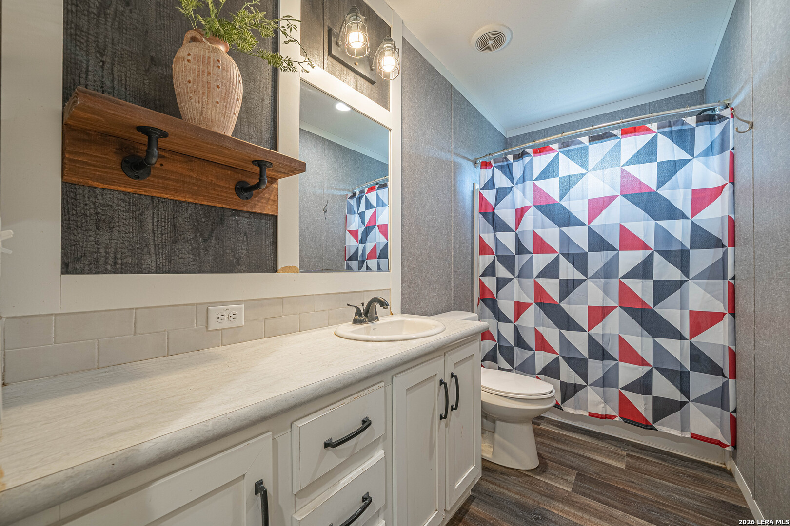 3433 Gander Slough Road Kingsbury, TX 78638 - Photo 20 of 23 a bathroom with a sink and a mirror