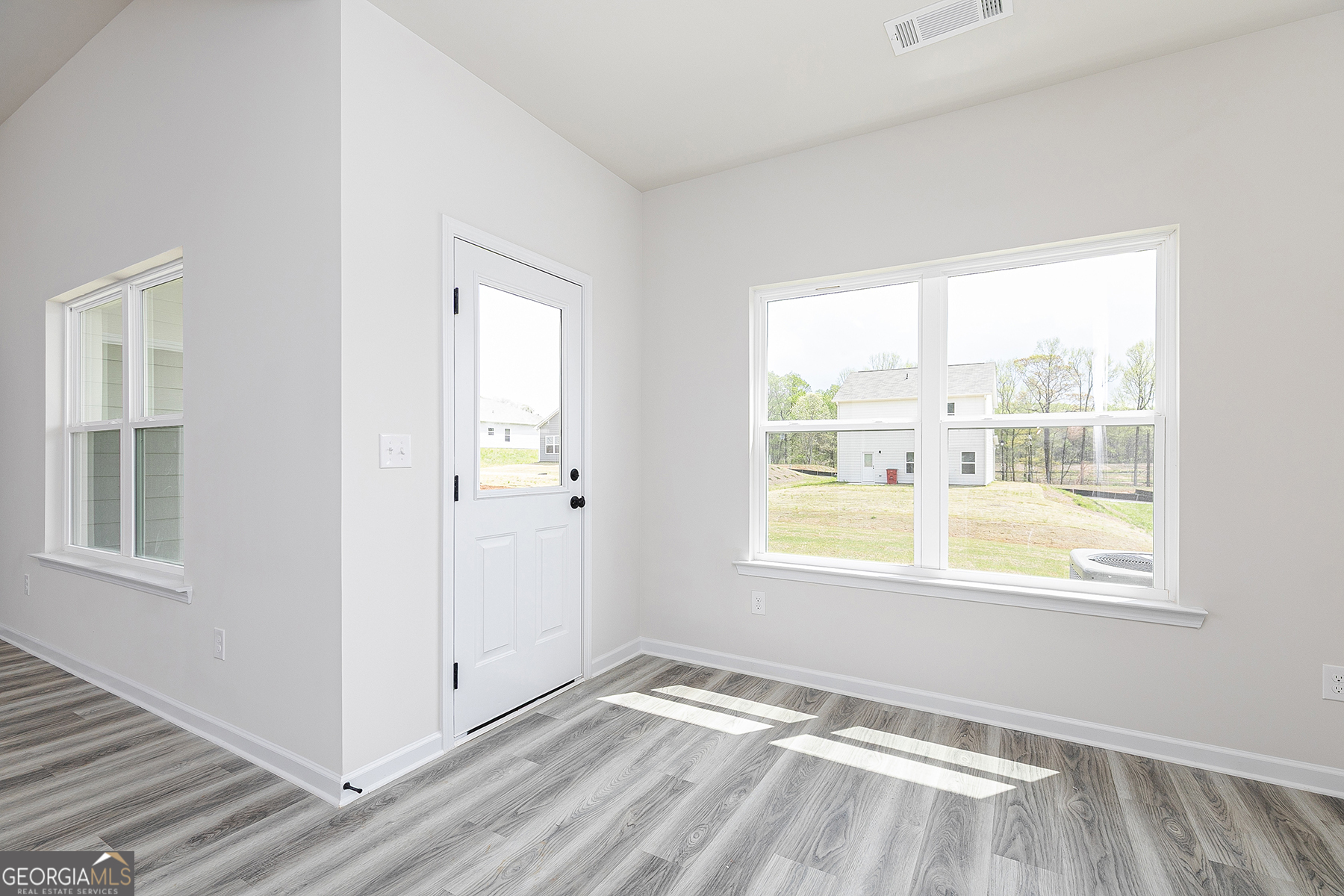 217 Darter Court Hoschton, GA 30548 - Photo 11 of 23 a view of an empty room and window