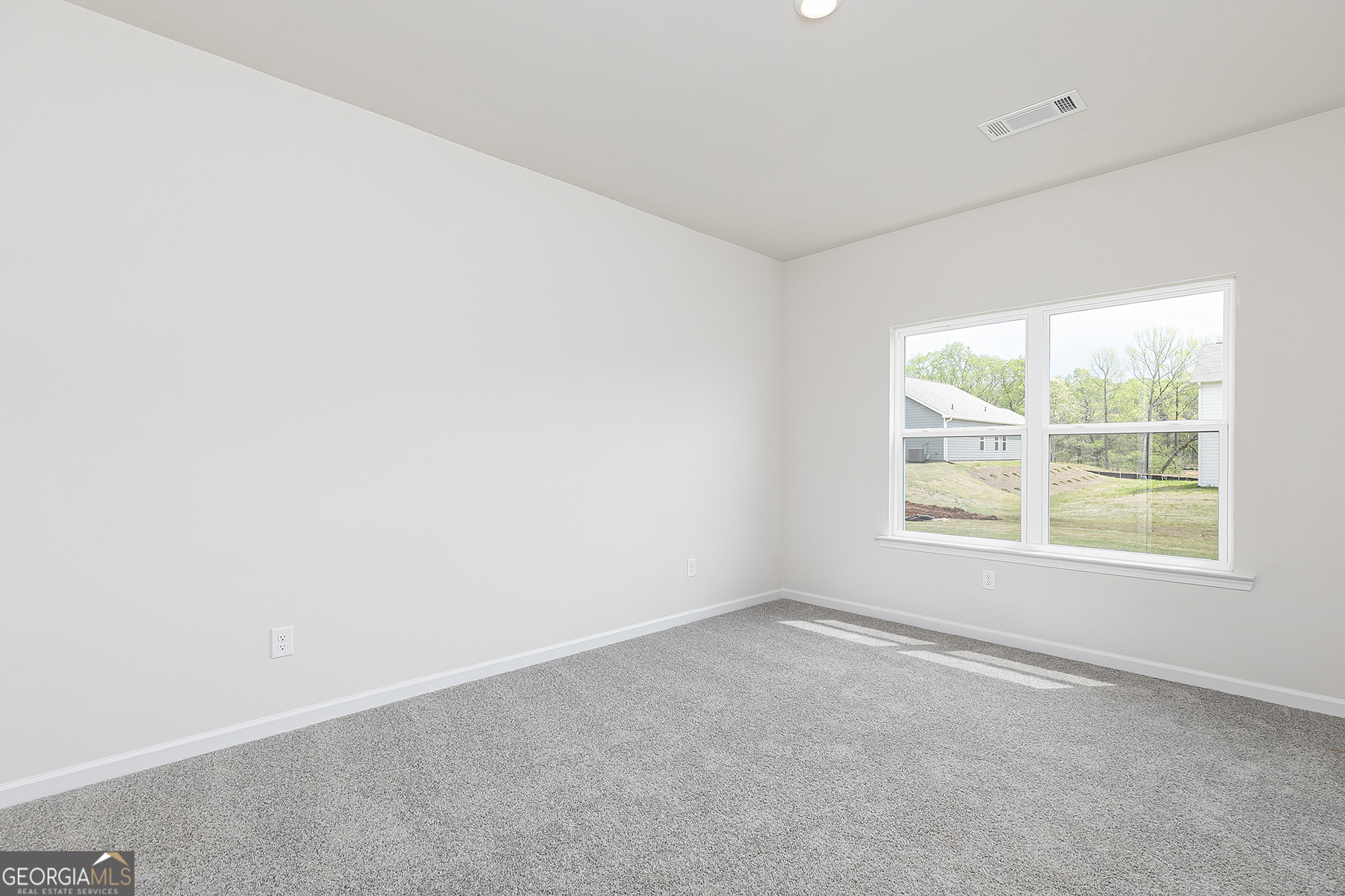 217 Darter Court Hoschton, GA 30548 - Photo 12 of 23 an empty room with a window