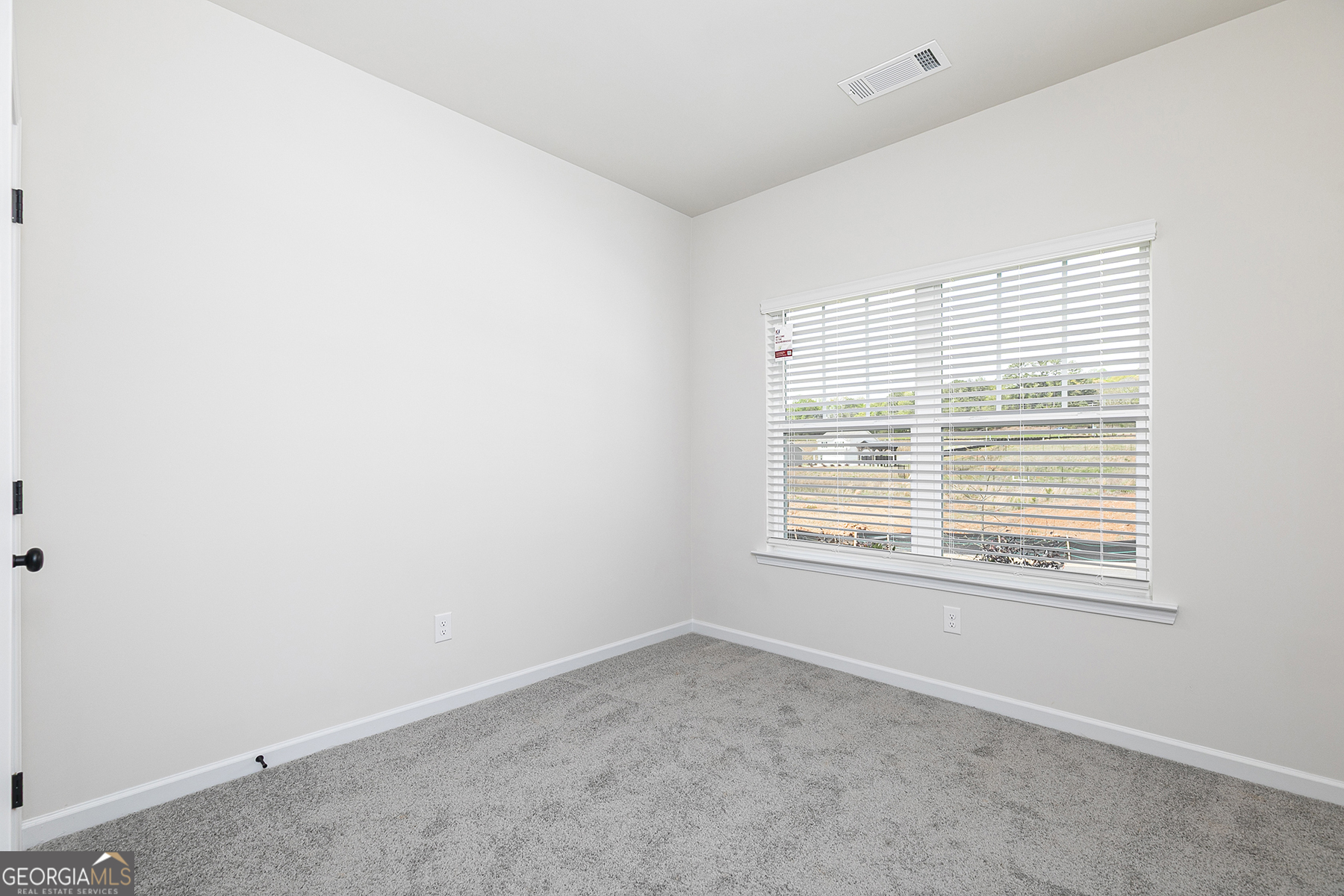 217 Darter Court Hoschton, GA 30548 - Photo 17 of 23 an empty room with a window