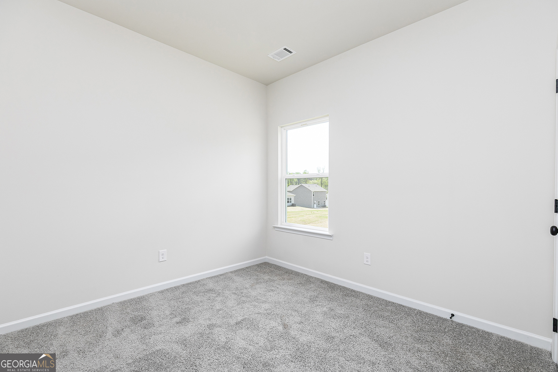 217 Darter Court Hoschton, GA 30548 - Photo 18 of 23 an empty room with a window